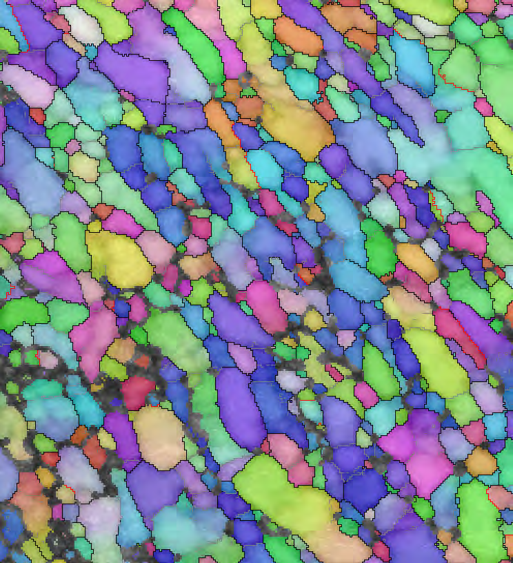 Fig. 4a. Pattern quality map of an HPT-deformed steel sample. Fig. 4b. Orientation map (IPF colouring) of the same area, with high angle boundaries in black, low angle boundaries in grey and Σ3 twin boundaries in red.